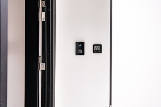 Modern smart home control panel on white wall